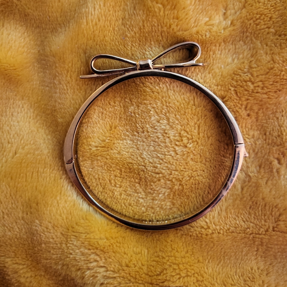 Rose gold tone Kate Spade bow bangle bracelet